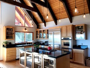 Enjoy cooking in this well-equipped kitchen with a large island and clear view of the appliances.