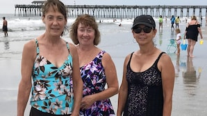 Three people standing on a beach with a pier in the background. - Beautiful  2B/2B, ground floor condo in Riverwalk on Arrowhead Golf course ! (Myrtle Beach)
