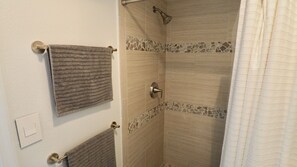 Shower, hair dryer, towels, soap