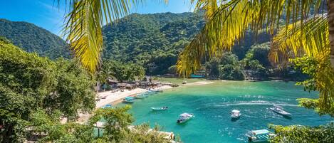 On the beach, sun loungers, beach towels