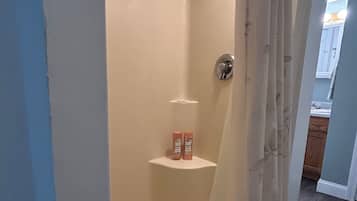 Shower, hair dryer, towels, toilet paper