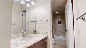 Bathtub, hair dryer, towels