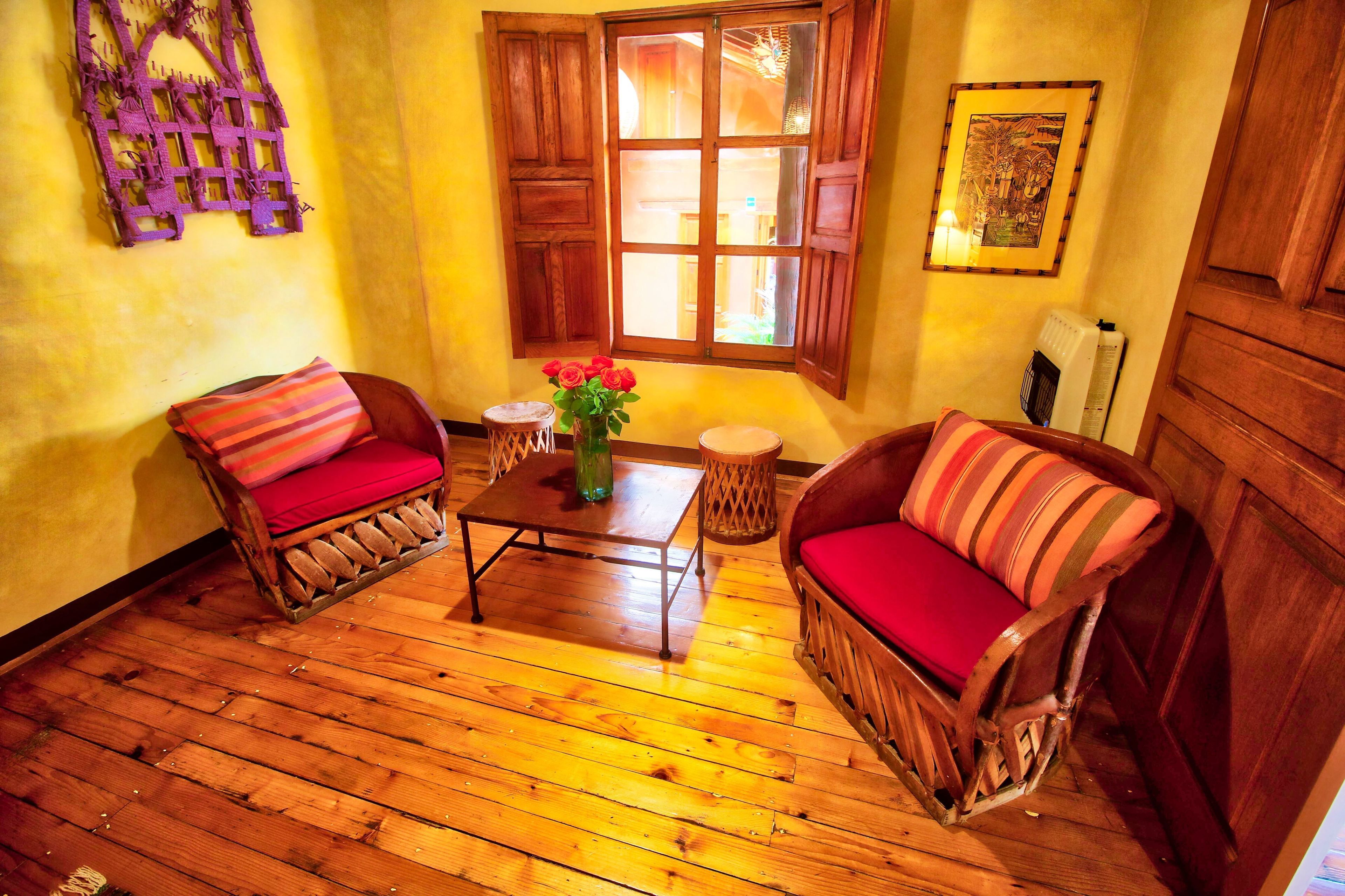 premium quadruple room, non smoking, courtyard view (arbol) | living area | flat-screen tv