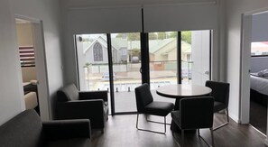 Apartment, 2 Bedrooms, 2 Bathrooms | Living area | 65-inch flat-screen TV with digital channels, TV