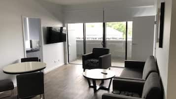 Apartment, 2 Bedrooms, 2 Bathrooms | Living area | 65-inch flat-screen TV with digital channels, TV