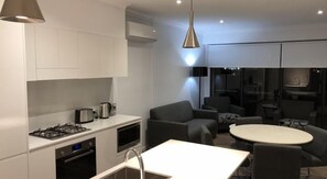Apartment, 2 Bedrooms, 2 Bathrooms | Living area | 65-inch flat-screen TV with digital channels, TV