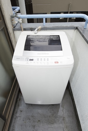 Enjoy a convenient laundry experience on your balcony with a front-loading washing machine.