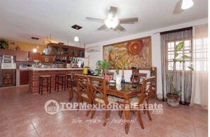 Cozy living area with a dining table and comfortable seating, perfect for relaxing and socializing.