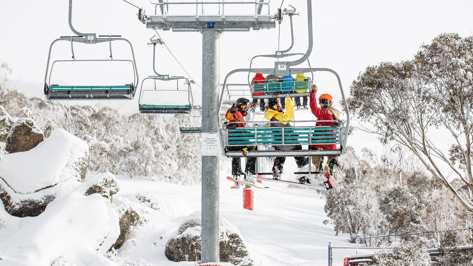 A ski lift with passengers.