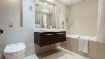 Bathtub, hair dryer, towels