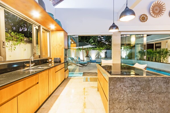 Fridge, microwave, stovetop, dining tables