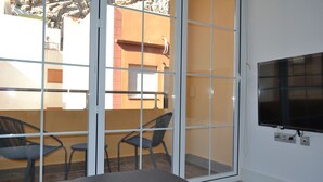 A room with a sliding glass door leading to an outdoor area with a table and chairs. - NEVERENDING RIJANA, Cala Rijana at your fingertips! (calahonda)