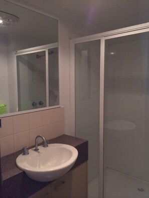 Combined shower/bathtub, soap, toilet paper