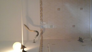 A bathroom with a bathtub, a shower, and a toilet. - very spacious, neat and organized (Gros Islet)