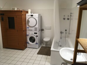 Combined shower/bathtub, hair dryer, towels, soap