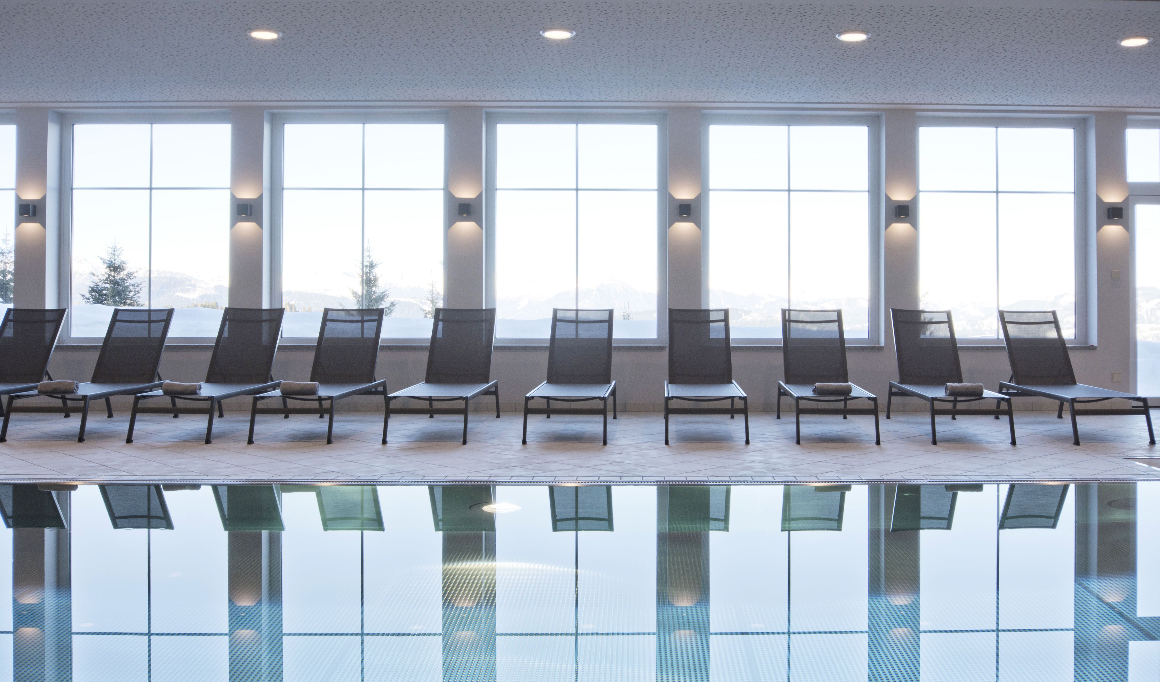 Indoor pool, open 8:00 AM to 8:00 PM, pool loungers