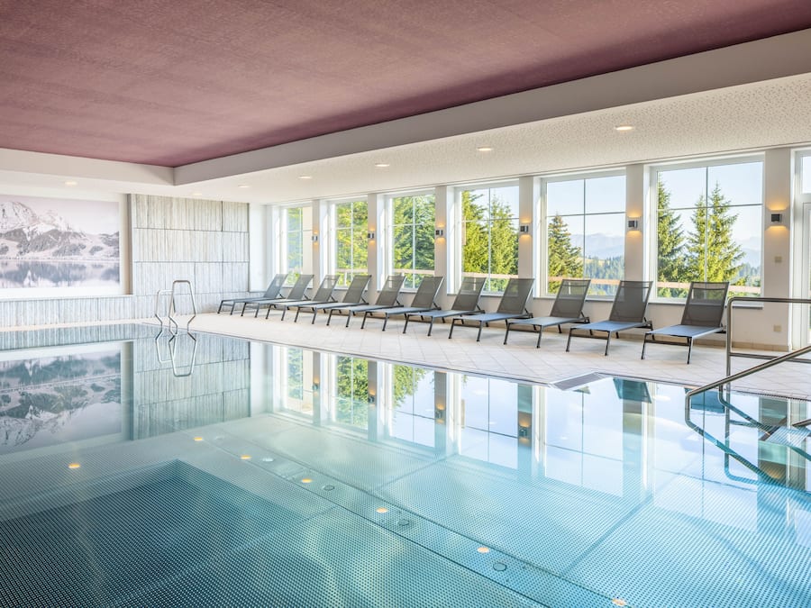 Indoor pool, open 8:00 AM to 8:00 PM, pool loungers