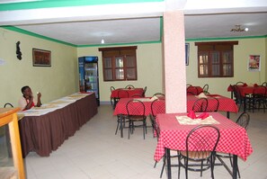 Breakfast, lunch, dinner served; local and international cuisine  - Pride Travellers Hotel (Mubende)