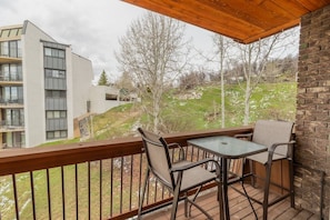 Inviting entry to Storm Meadows—nestled in nature with colorful blooms and a warm mountain-lodge feel.