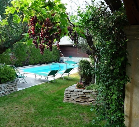 Seasonal outdoor pool, open 9:30 AM to 6:30 PM, sun loungers