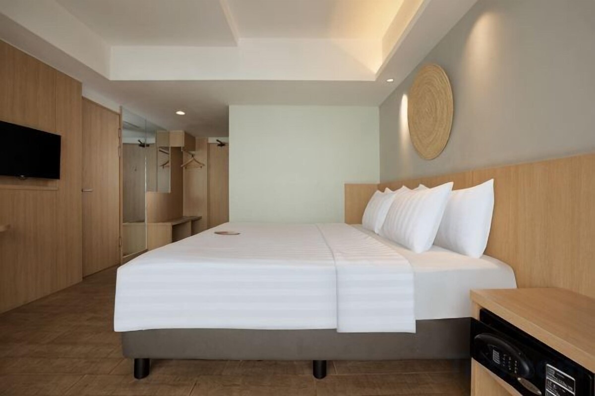 Ropa de cama de alta calidad, minibar, caja fuerte y escritorio
