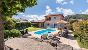 A two-story house with a swimming pool, outdoor seating, and a garden. - Villa du Bonheur for 8 people with private pool (Vallon-Pont-d'Arc)