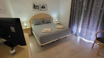 2 dormitorios, tabla de planchar con plancha, wifi gratis y ropa de cama