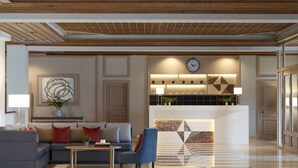 A modern lobby with a reception desk, seating area, and a decorative wall. - The Lake Hotel (Ioannina)