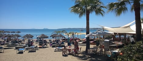 On the beach, sun loungers