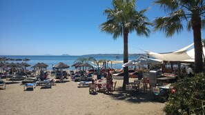 On the beach, sun-loungers, beach towels