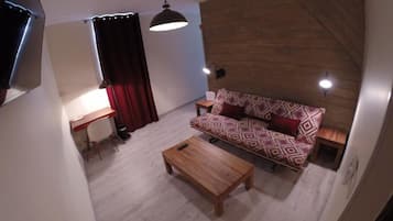 Suite, 1 Queen Bed with Sofa bed | Living room | Flat-screen TV