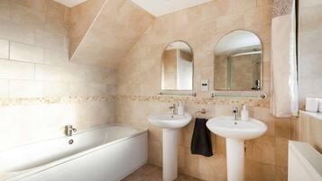 Bathtub, hair dryer, towels