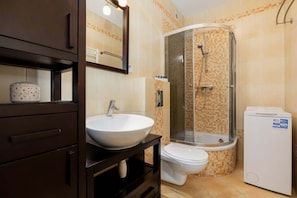 Shower, hair dryer, towels, shampoo