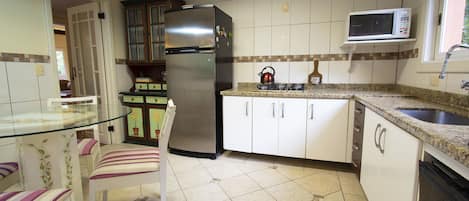 House | Private kitchen | Full-sized fridge, microwave, stovetop, cookware/dishes/utensils