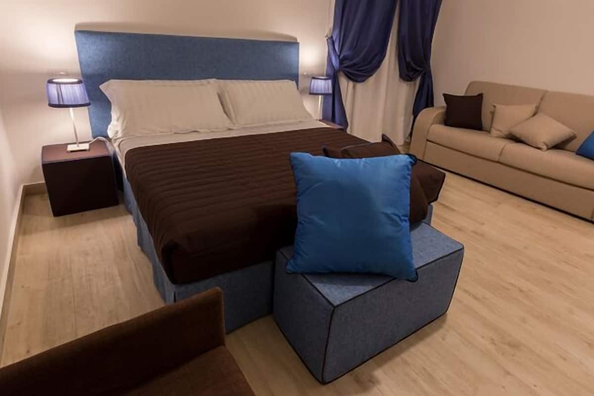 Habitación cuádruple | Cunas gratuitas, wifi gratis, ropa de cama