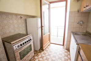 Appartamento, 1 camera da letto | Cucina privata | Frigorifero con congelatore, forno, piano cottura