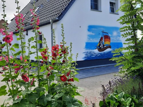 Ferienhaus (DHH) am Kubitzer Bodden mit Kamin und großem Garten