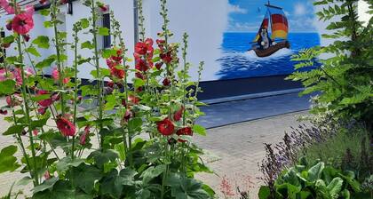 Ferienhaus (DHH) am Kubitzer Bodden mit Kamin und großem Garten