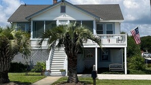 A two-story house with a front porch, a mailbox, and an American flag. - Ocean views everywhere! / Beach access in front of house! /close to restaurants. (Isle of Palms)