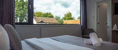 Premium bedding, blackout drapes, free WiFi, bed sheets