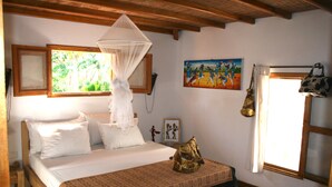 A bedroom with a bed, a canopy, a painting, and a window with curtains. - ONE OF THE MOST ELEGANT VILLAS IN THE SMALL COAST (Saly)
