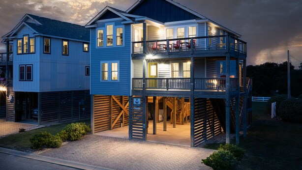 A two-story building with a balcony and a covered entrance. - Dog Friendly - Sound View Home on private harbor. Amazing Sunsets-Fishing-Dock (Salvo)