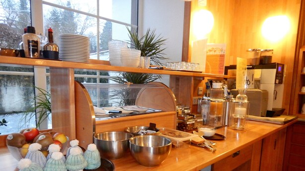 A kitchen counter with various items including bowls, bottles, and a coffee machine. - Havergoh Wander- & Fahrrad-Hotel (Horn-Bad Meinberg)
