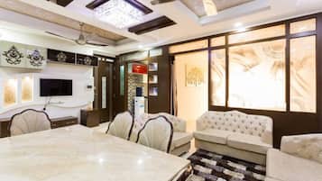 Premium Apartment, Multiple Beds, Accessible, City View | Living area | 32-inch flat-screen TV with cable channels, LED TV
