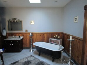 Bathtub, hair dryer, towels, soap