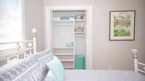 A bedroom with a bed, a white wardrobe, and a framed picture on the wall. - Medical & Work Stay · Quiet · Fenced Pet · Friendly (Durham)