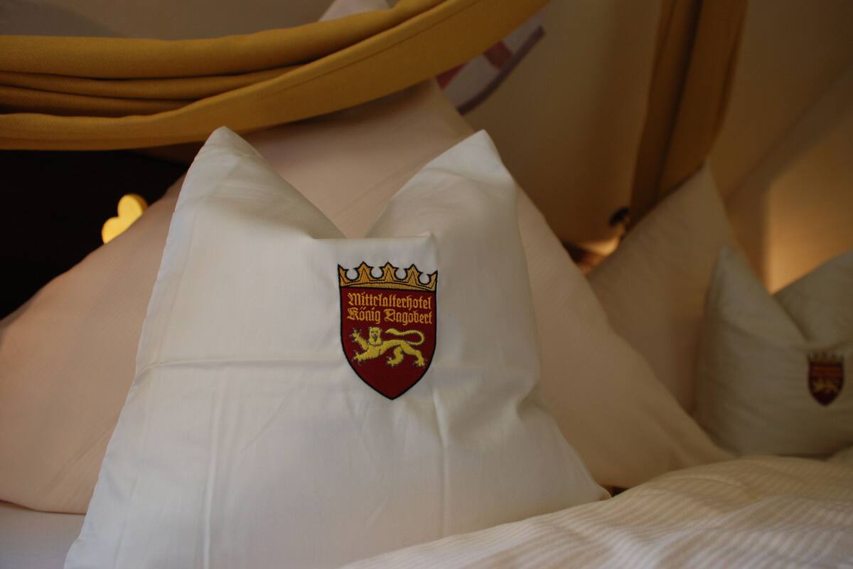 A pillow with a crest emblem.