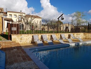 Seasonal outdoor pool, pool loungers