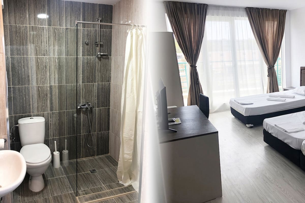 Luxe beddengoed, een minibar, een bureau, een laptopwerkplek