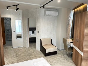 Standard Apartment | Living area | 32-inch flat-screen TV with cable channels, TV